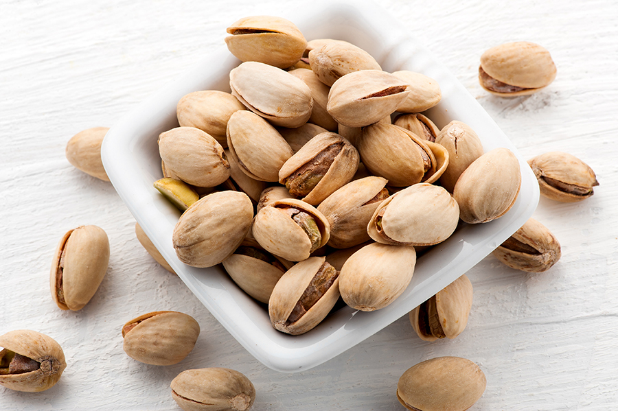 Roasted pistachio nuts in a square bowl Pistachio Strawberry Bowl