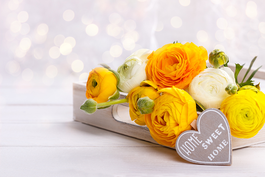Bouquet of yellow ranunculus setting health and wellness goals