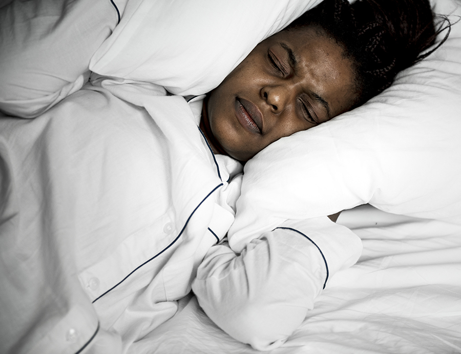 A woman with problem sleeping how clutter affects your life